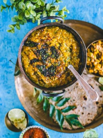 Methi Dal served in a small kadai with a spoon in it