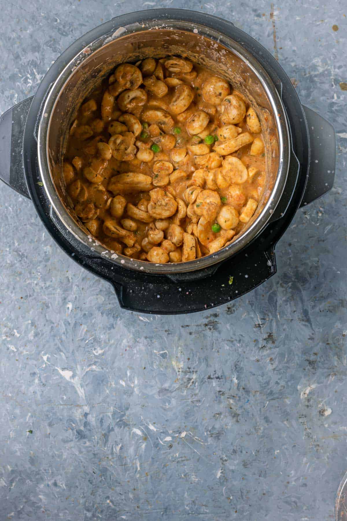 Instant Pot ready for pressure cooking the mushroom masala.