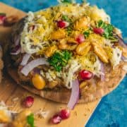Dabeli Pita Bread Pizza garnished with sev and peanuts on top