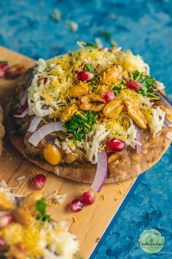 Dabeli Pita Bread Pizza garnished with sev and peanuts on top
