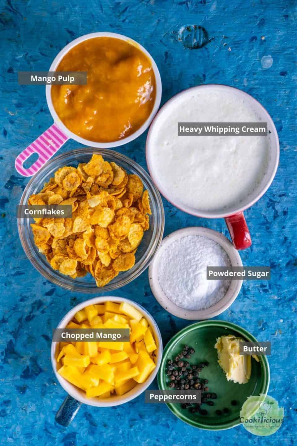 all the ingredients needed to make Mango Cranachan placed on a table with labels on them.