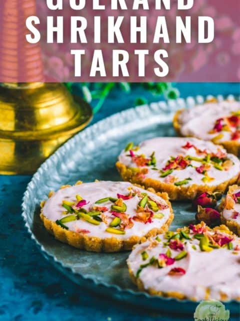 a couple of Gulkand Shrikhand Sweet Tarts served in a tray and text at the top