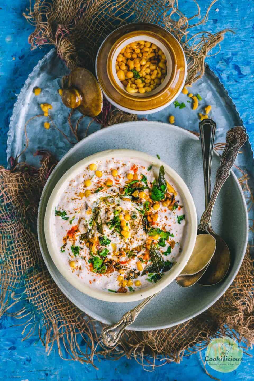 Burani Boondi Raita served in a round bowl with a bowl of boondi on the side
