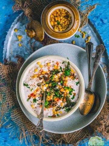 Burani Boondi Raita served in a bowl with a spoon in it