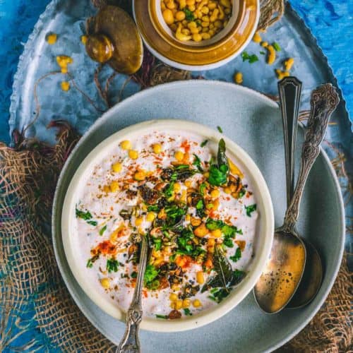 Burani Boondi Raita served in a bowl with a spoon in it