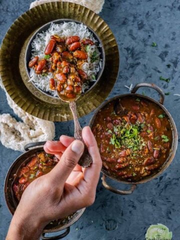 A spoonful of Instant pot rajma masala over a bowl of rice