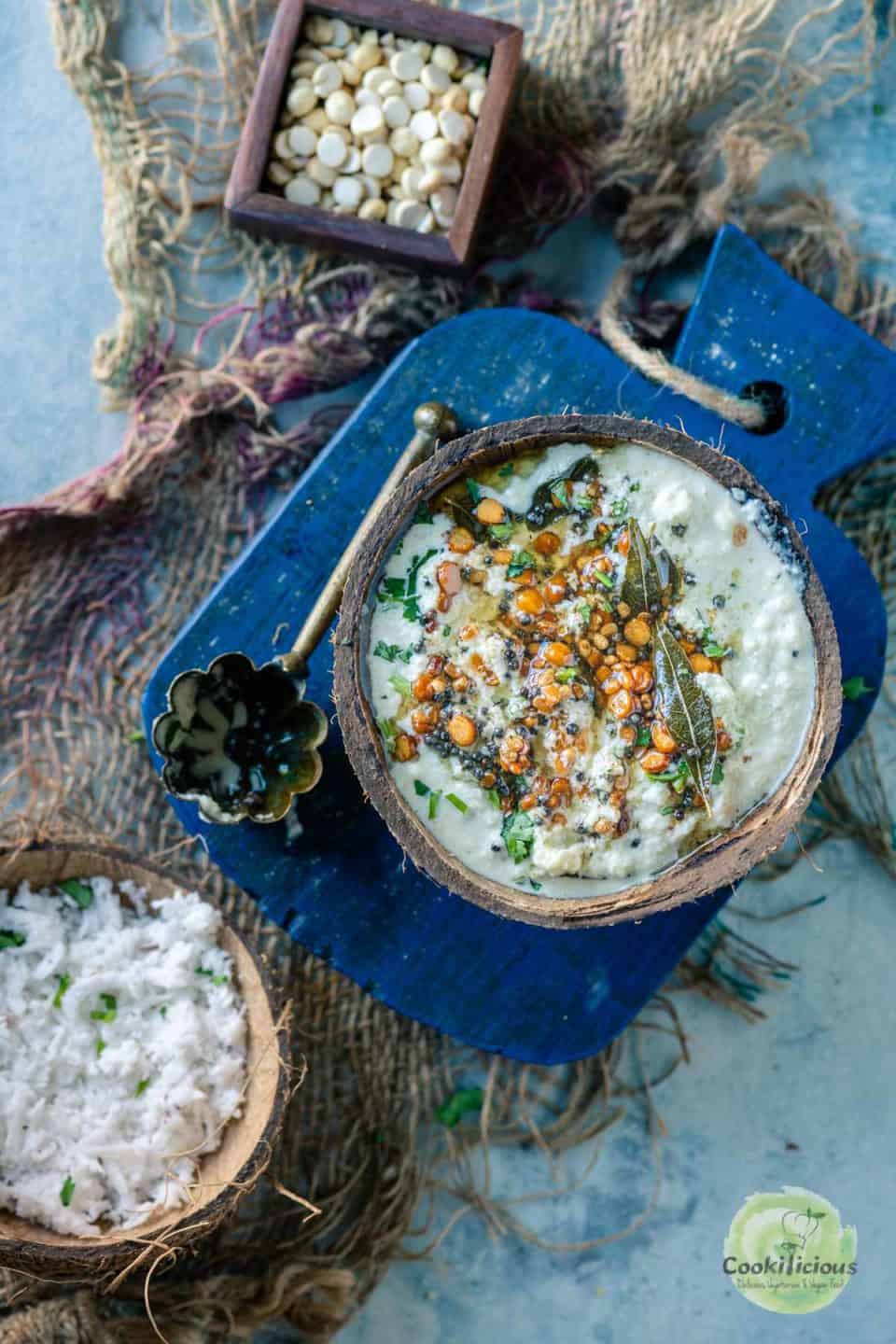 Coconut Chutney served in a bowl with shredded coconut on the side