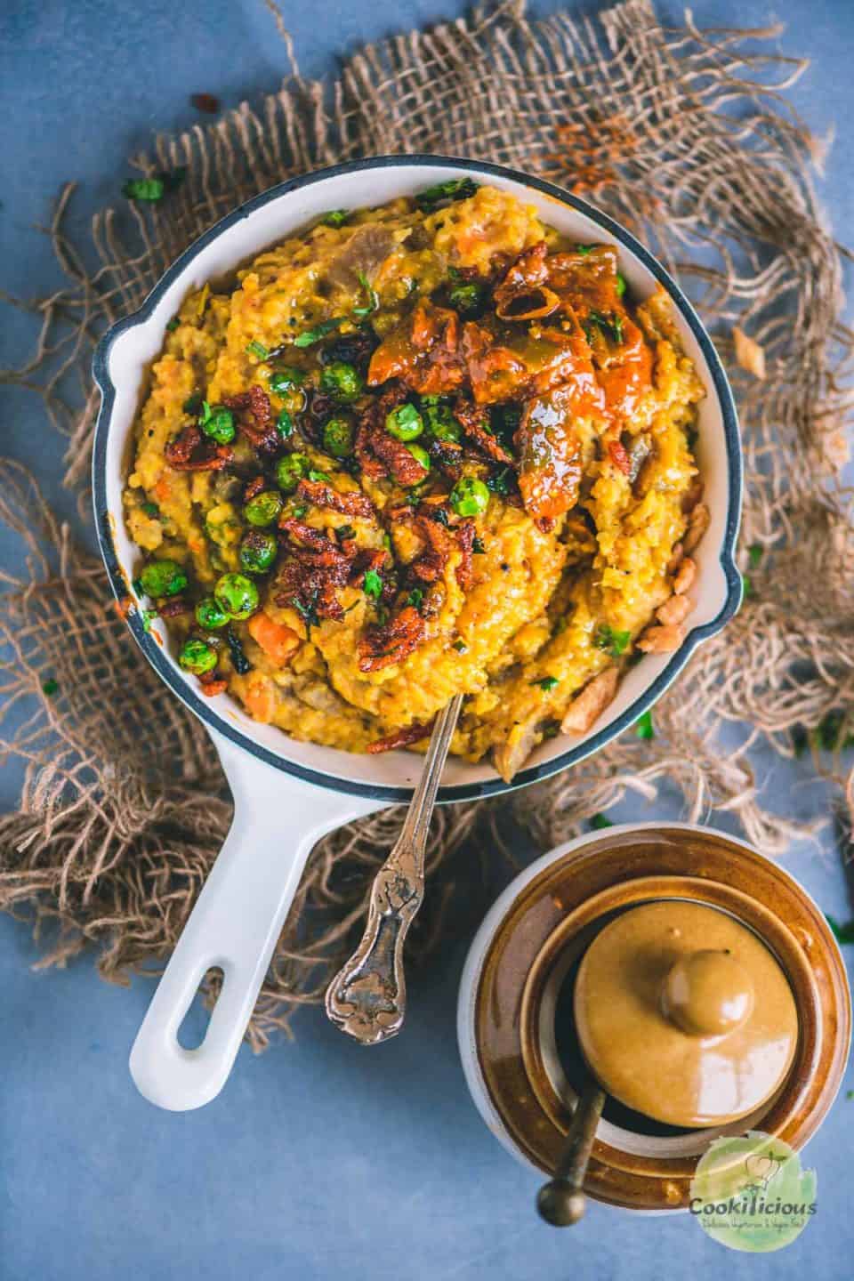 Instant Pot Masala Khichdi served in a platter with pickle on top