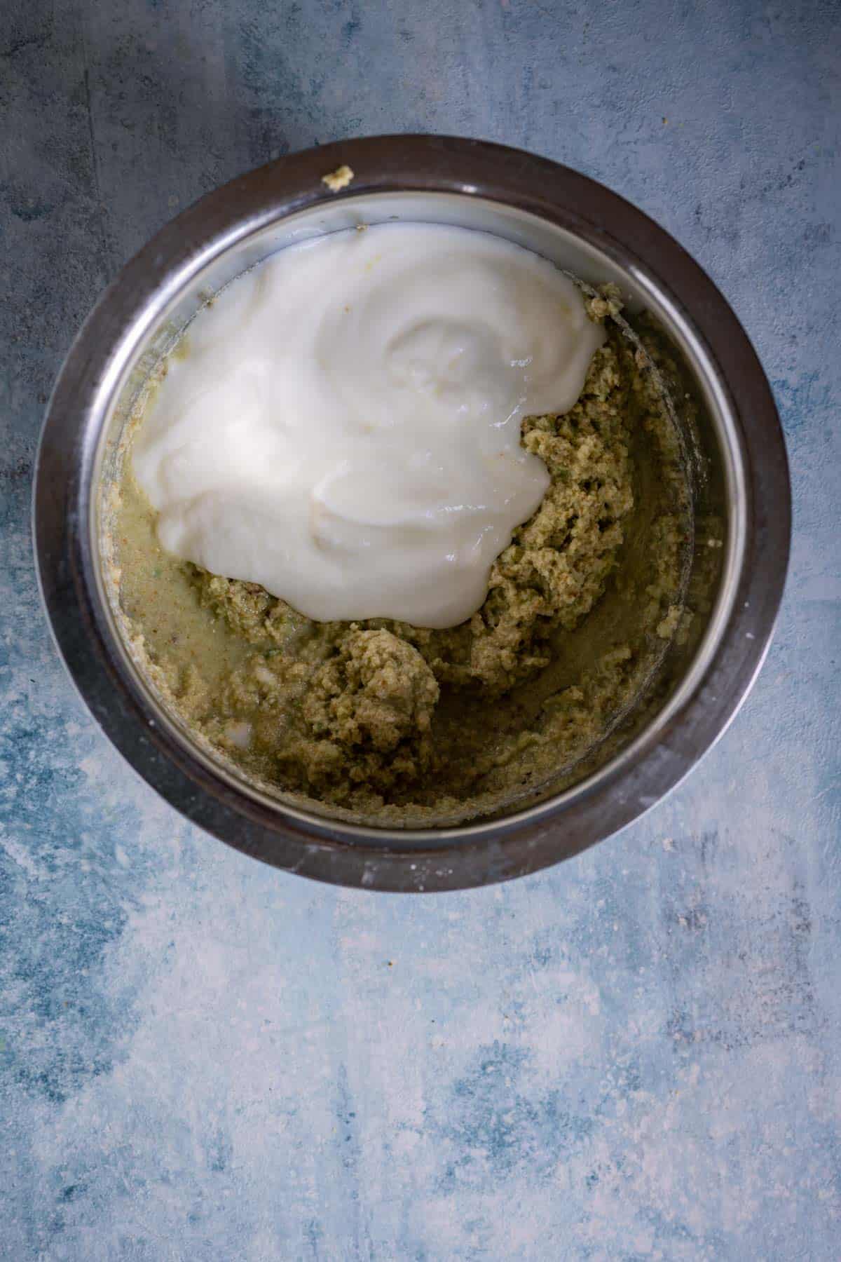 Yogurt whisked into the ground coconut paste for Tamil-style avial.