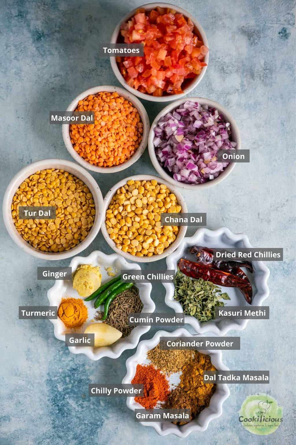 all the ingredients needed to make Dal Tadka in Instant Pot placed on a table with labels on them
