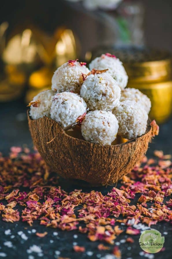 a coconut shell filled with Vegan Coconut Ladoos