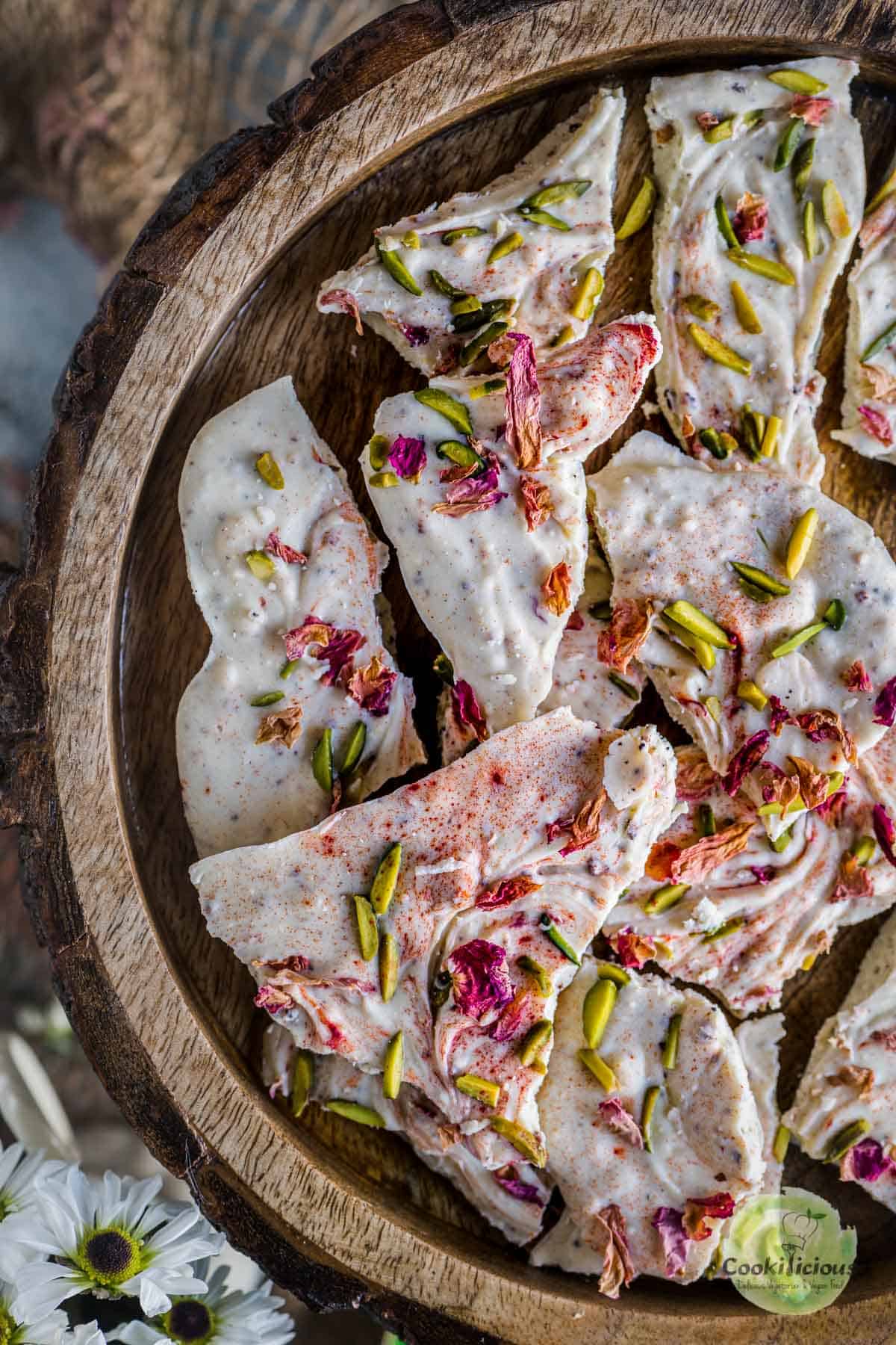 image of half a plate filled with White Chocolate Thandai Bark