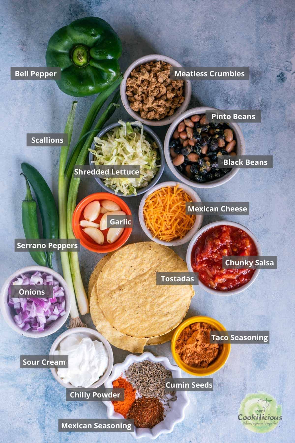 all the ingredients needed to make Vegan Corn Tostadas placed on a table with labels on them