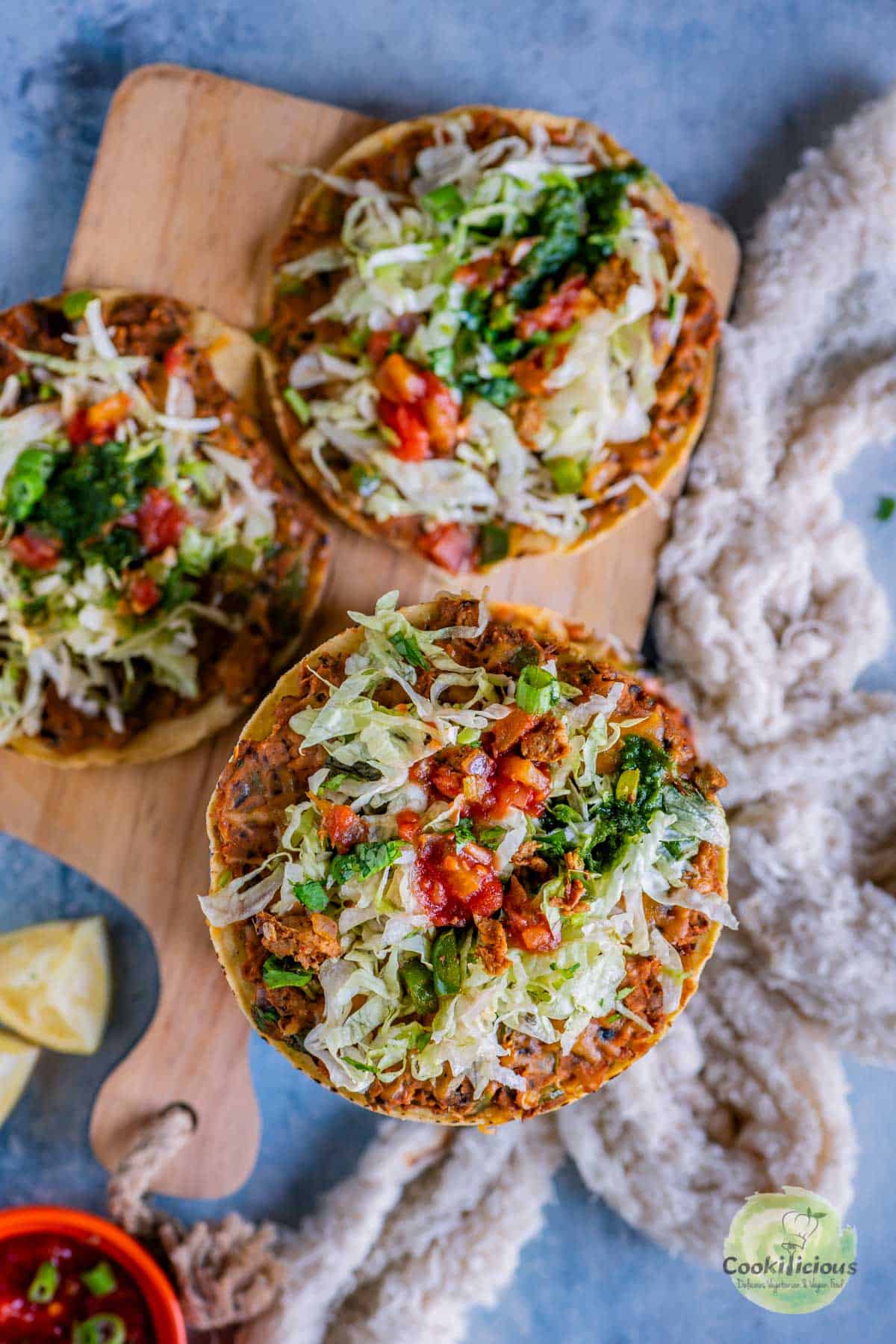 close up of one Vegan Corn Tostada while the remaining 2 are in the background
