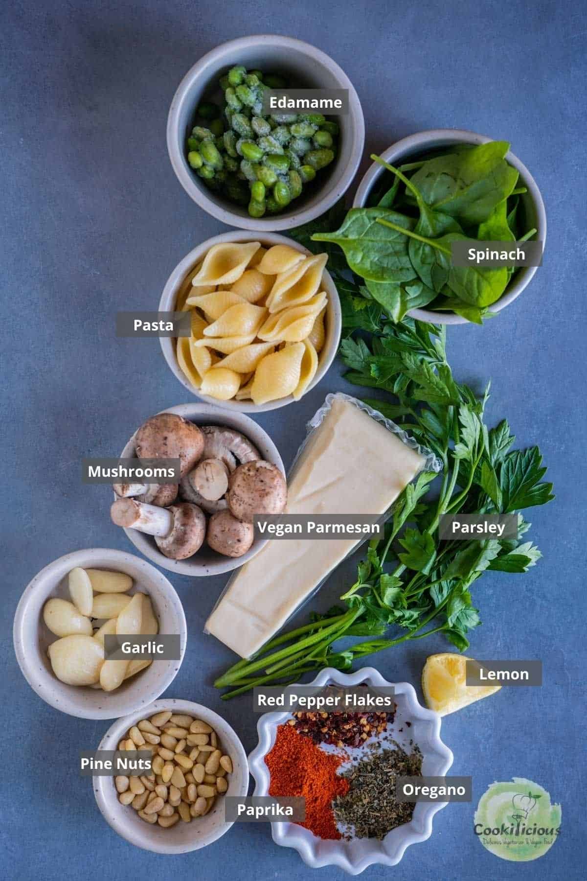 all the ingredients needed to make Vegan Mushroom Spinach Pasta Salad placed on the table with labels on them