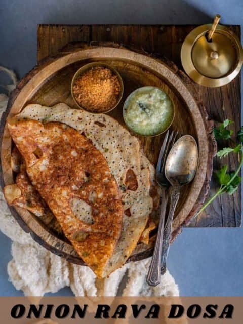 half folded Onion Rava Dosa served with chutneys and text at the bottom