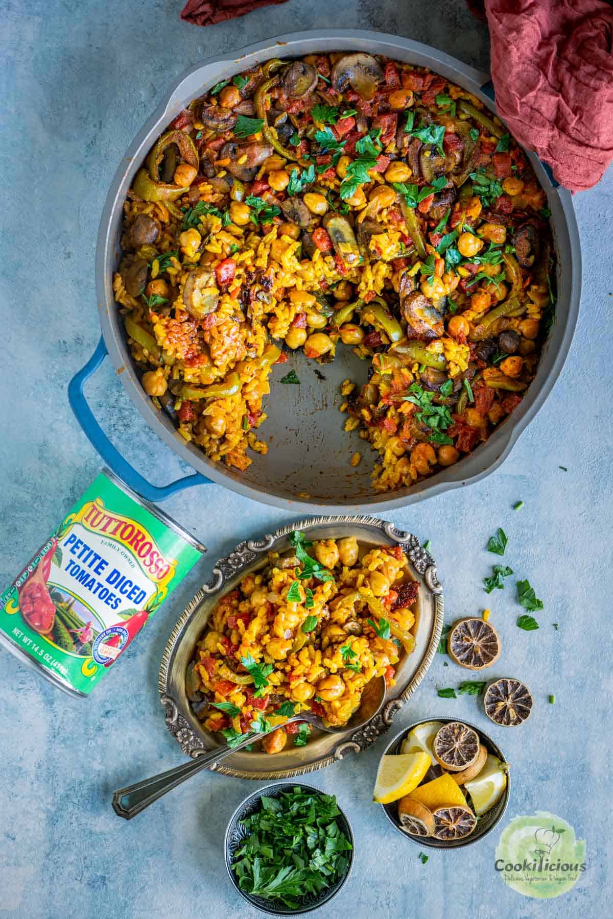 Vegan Paella in a pan and a small plate with paella on it