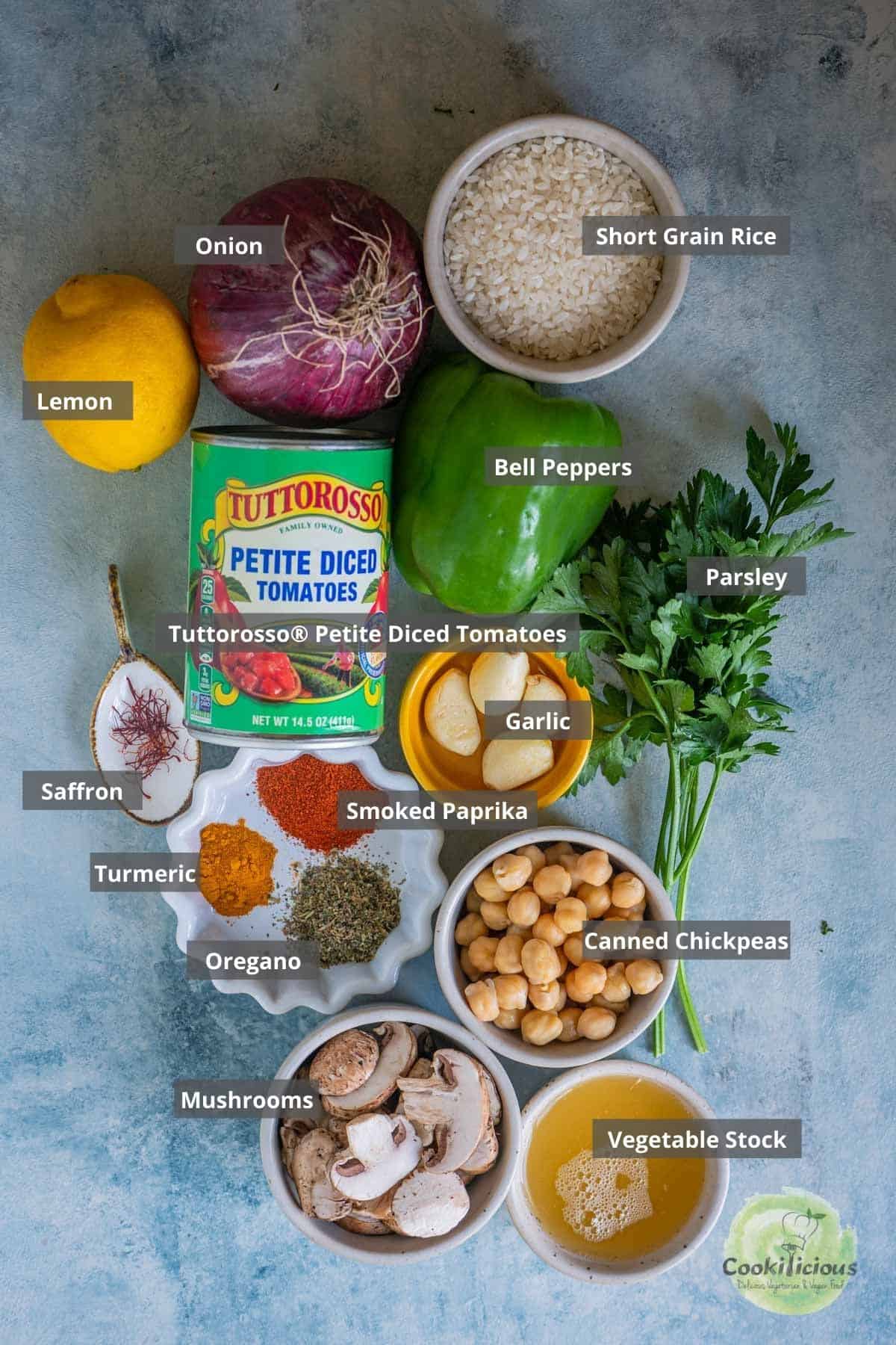all the ingredients needed to make Vegan Paella Recipe placed on a table with labels on them