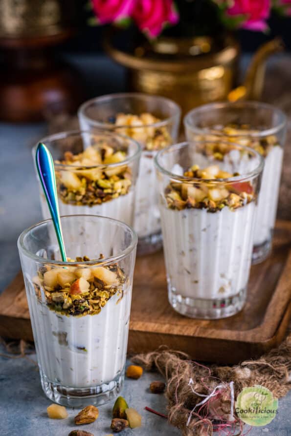 one Apple Pistachio Mousse jar with a spoon in it and 4 more jars behind it