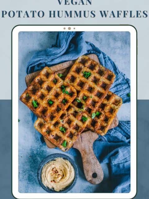 4 Potato Hummus Waffles served on a wooden tray with a bowl of hummus on the side and text at the top and bottom