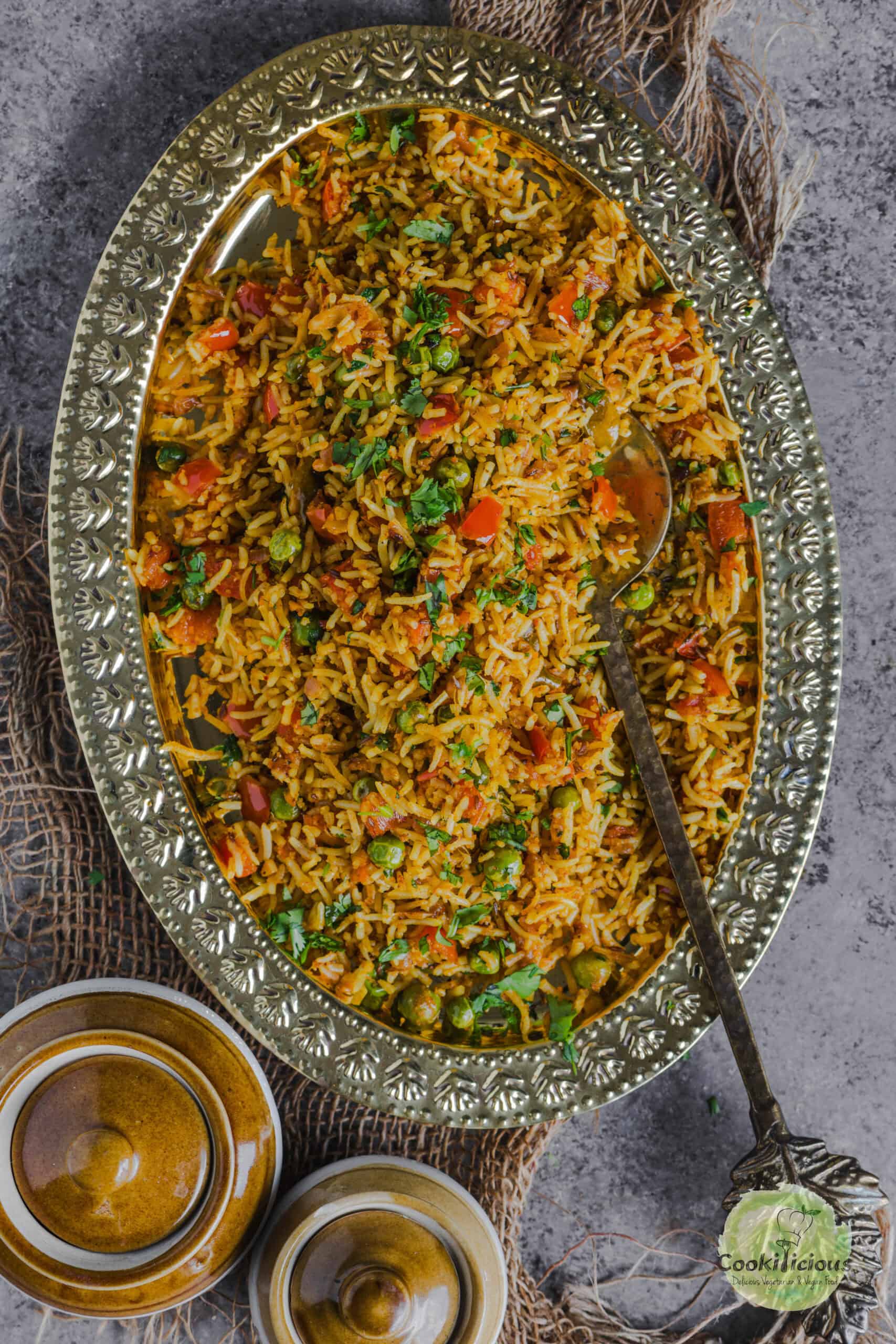 Freshly made South Indian Capsicum Rice served in an oval platter.
