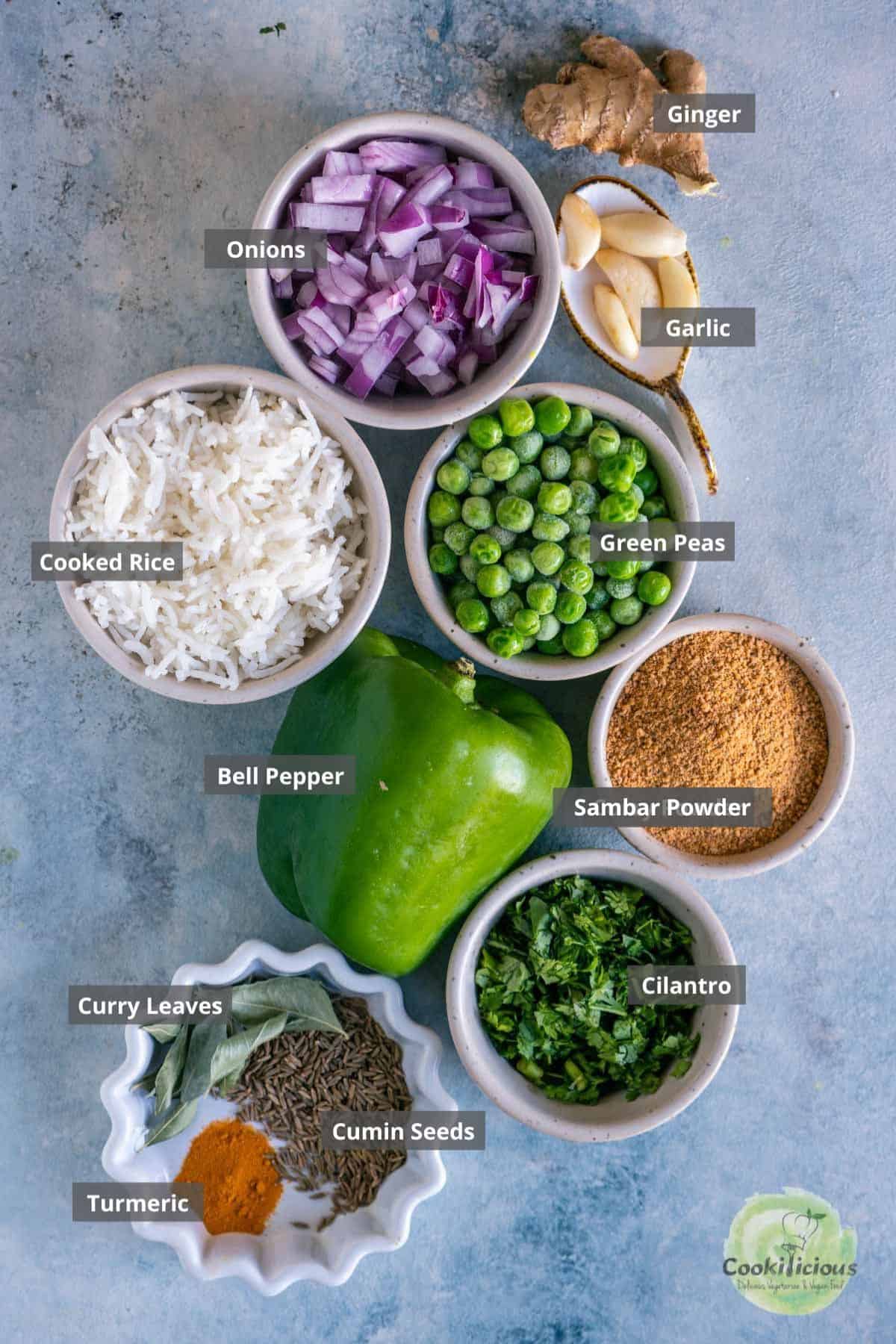 all the ingredients needed to make Capsicum Rice placed on a table with labels on them.