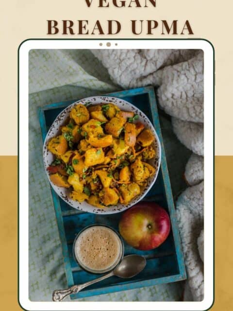 Bread Upma served in a tray with an apple and cup of chai next to it and text at the top and bottom