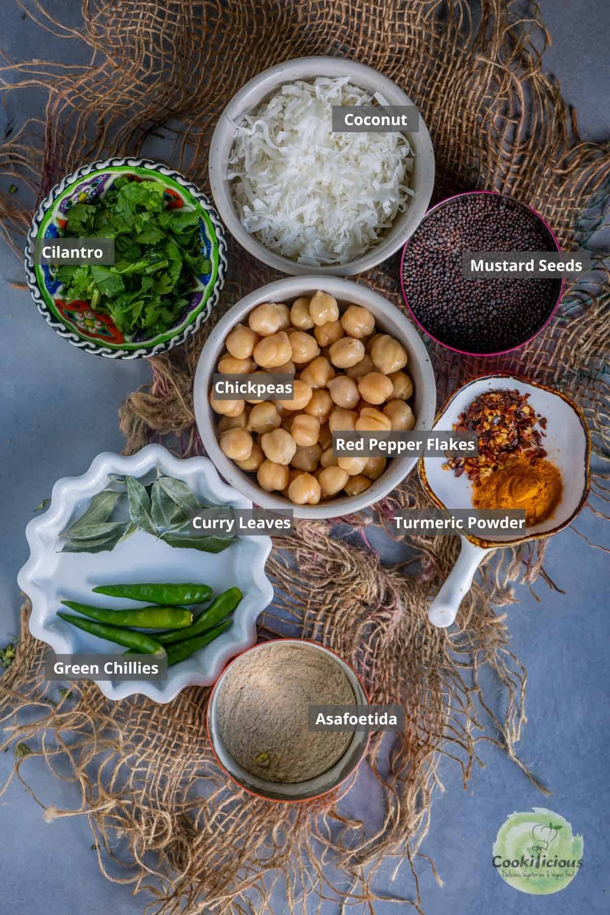 all the ingredients needed to make chickpea sundal placed on a table with labels on them