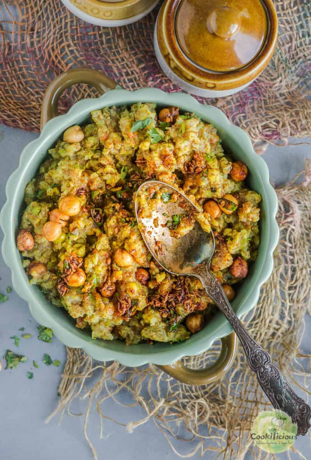 a spoon resting over a bowl of Instant Pot Teff Quinoa Khichdi