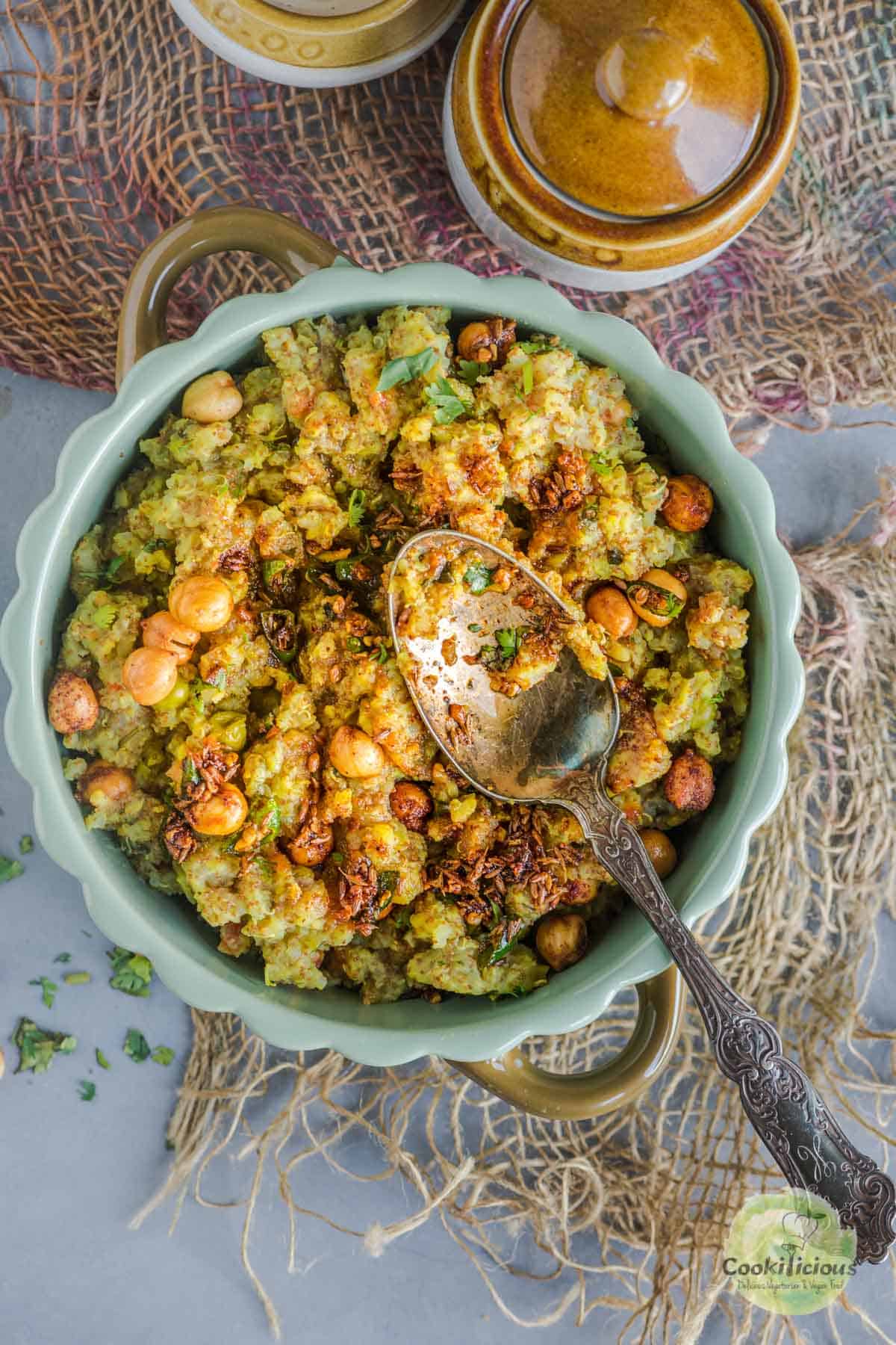 a spoon resting over a bowl of Instant Pot Teff Quinoa Khichdi