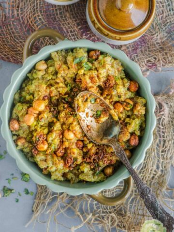 a spoon resting over a bowl of Instant Pot Teff Quinoa Khichdi