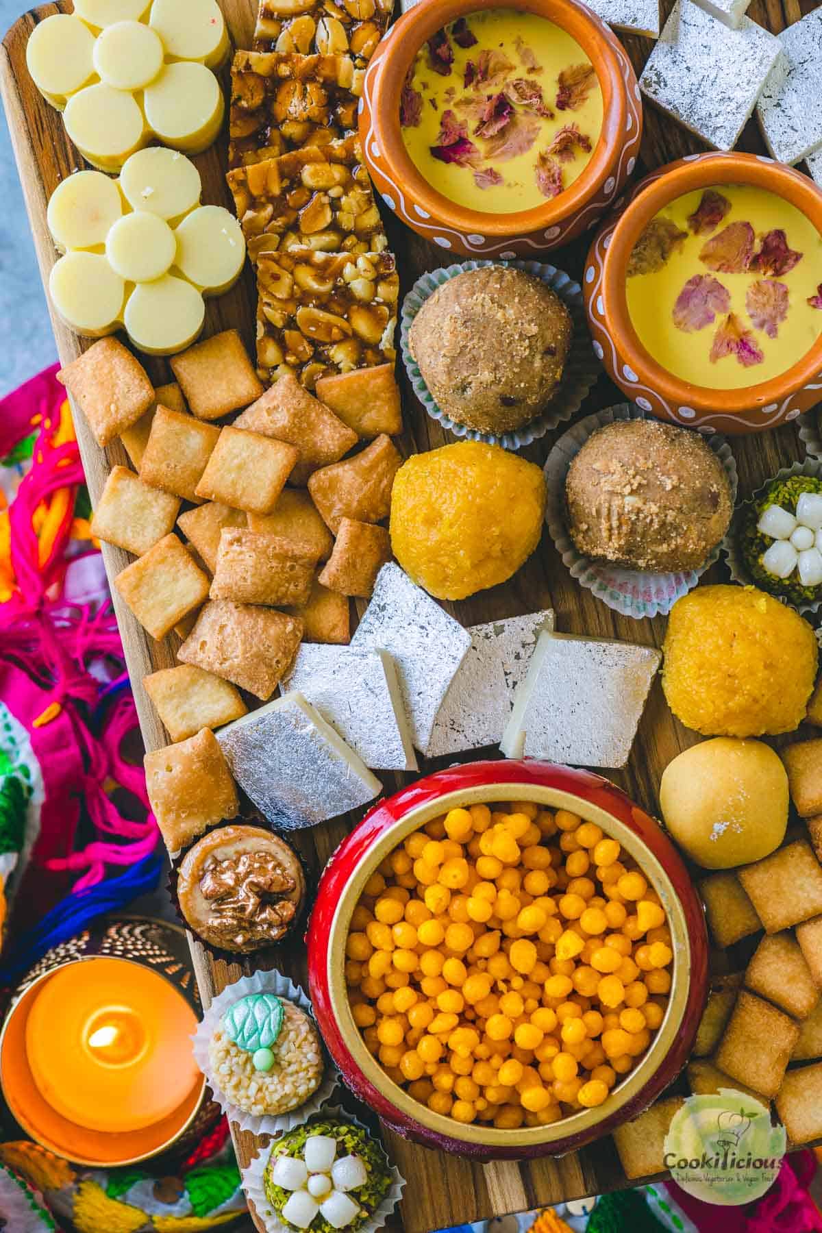 Indian sweets served in a wooden board