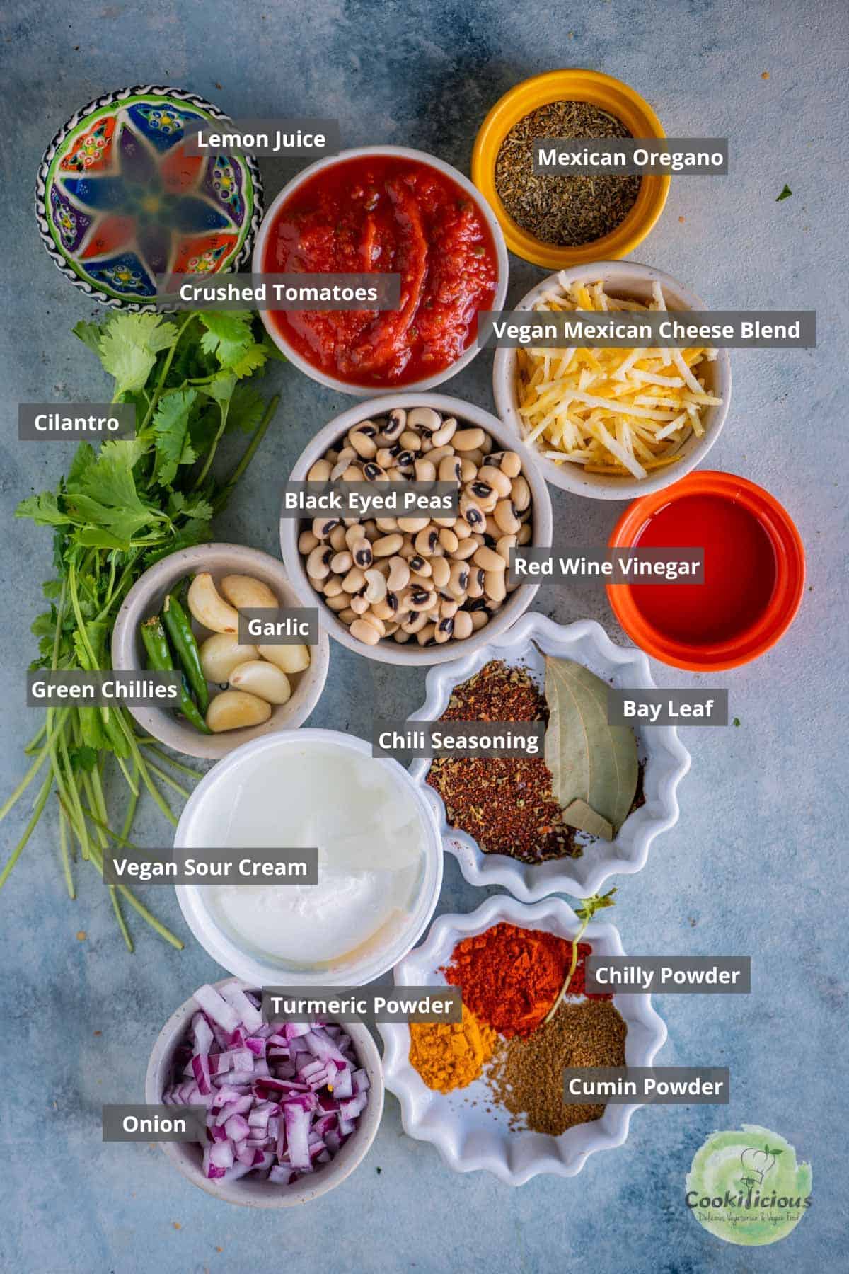 all the ingredients needed to make Instant Pot Black-Eyed Peas Vegan Chili placed on a tray with labels on them