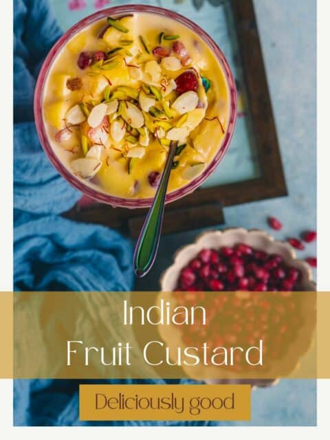 one bowl of Indian Fruit Custard with a spoon in it and text at the bottom