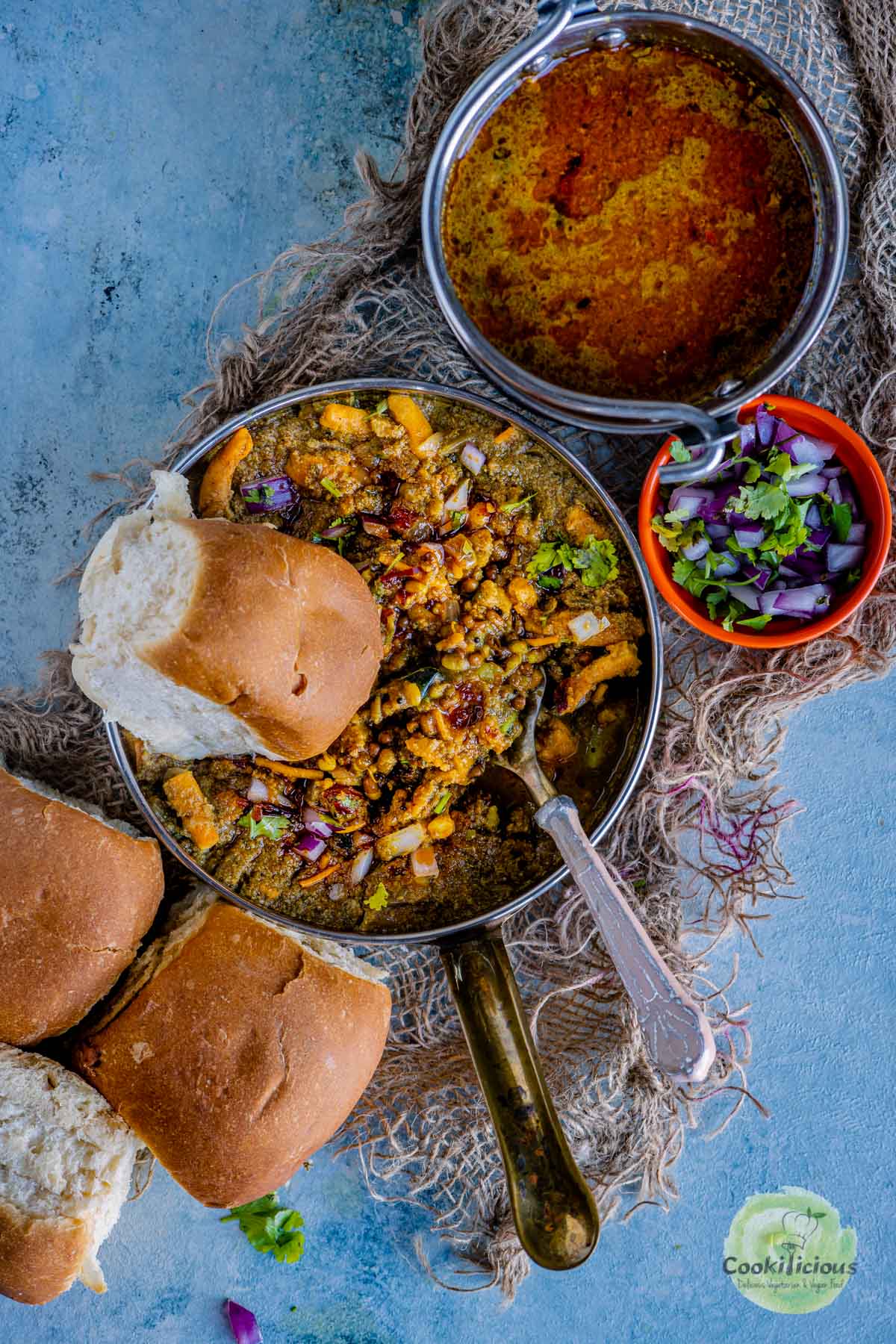 a bowl of misal with one pav on top
