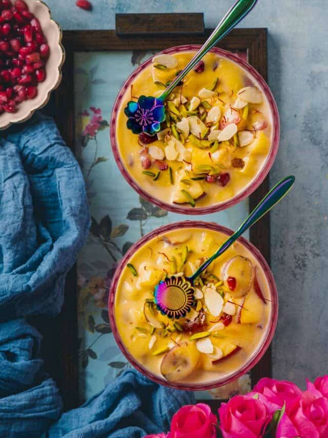 Indian Fruit Custard served in 2 bowls with spoons resting on top