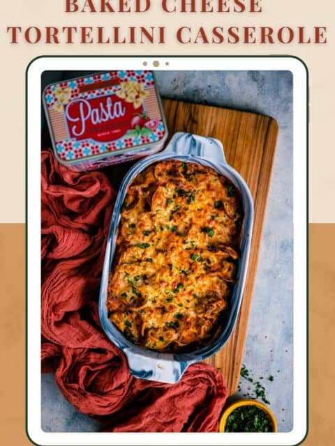 Baked Tortellini Casserole placed on a wooden board with a pasta tin on the side and text at the top and bottom