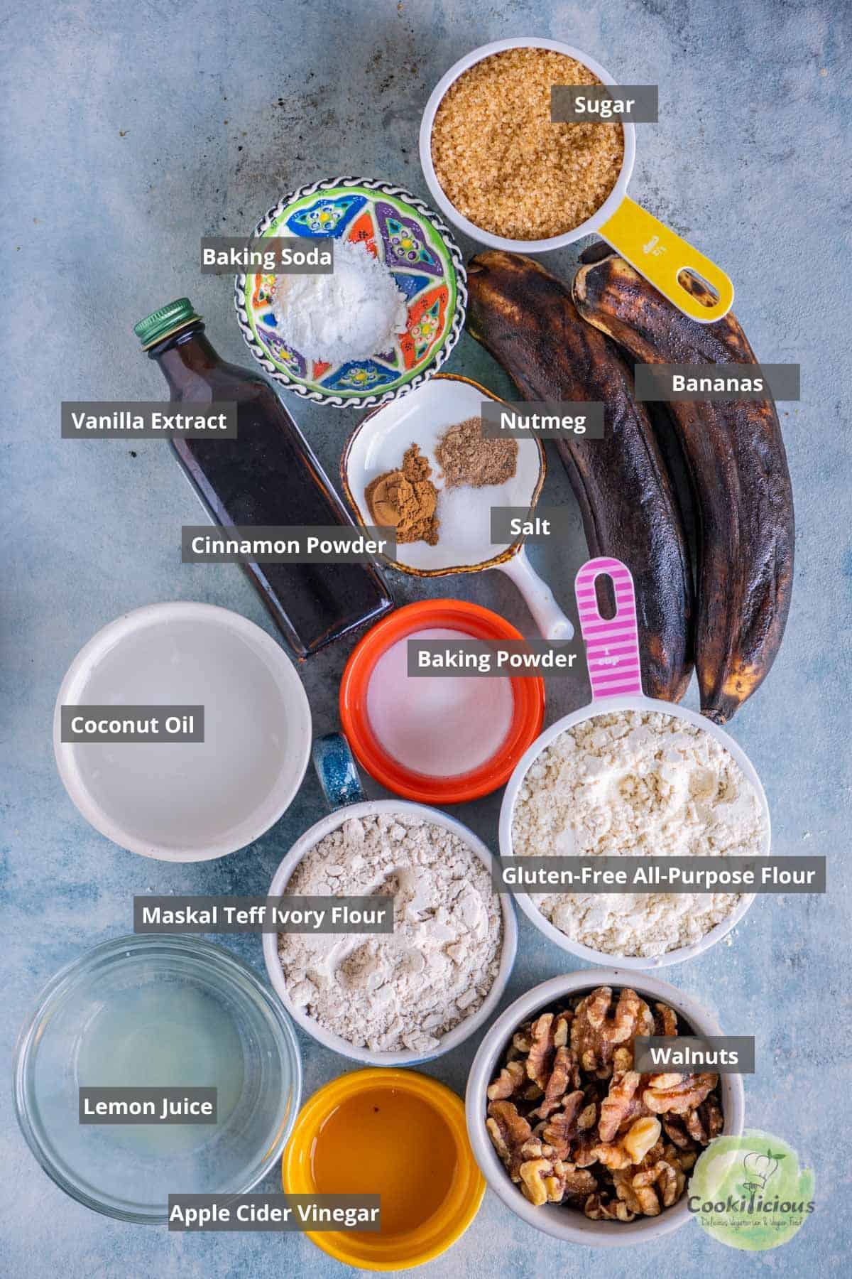 all the ingredients needed to make Vegan Gluten-free Banana Strawberry Bread placed on a table with labels on them