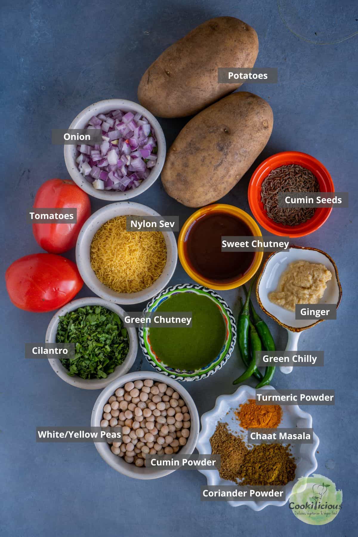 all the ingredients needed to make Ragda Patties (Ragda Pattice) placed on a table with labels on them.