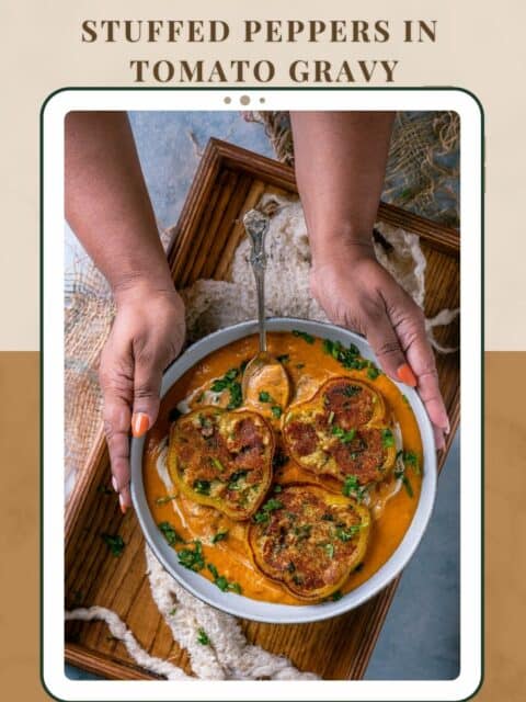 Set of hands holding a bowl of Paneer Masala Stuffed Peppers In Creamy Tomato Gravy and text at the top and bottom.