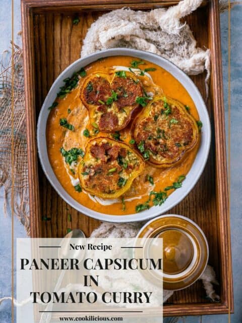 Paneer Masala Stuffed Peppers In Creamy Tomato Gravy placed on a wooden tray and text at the bottom left.