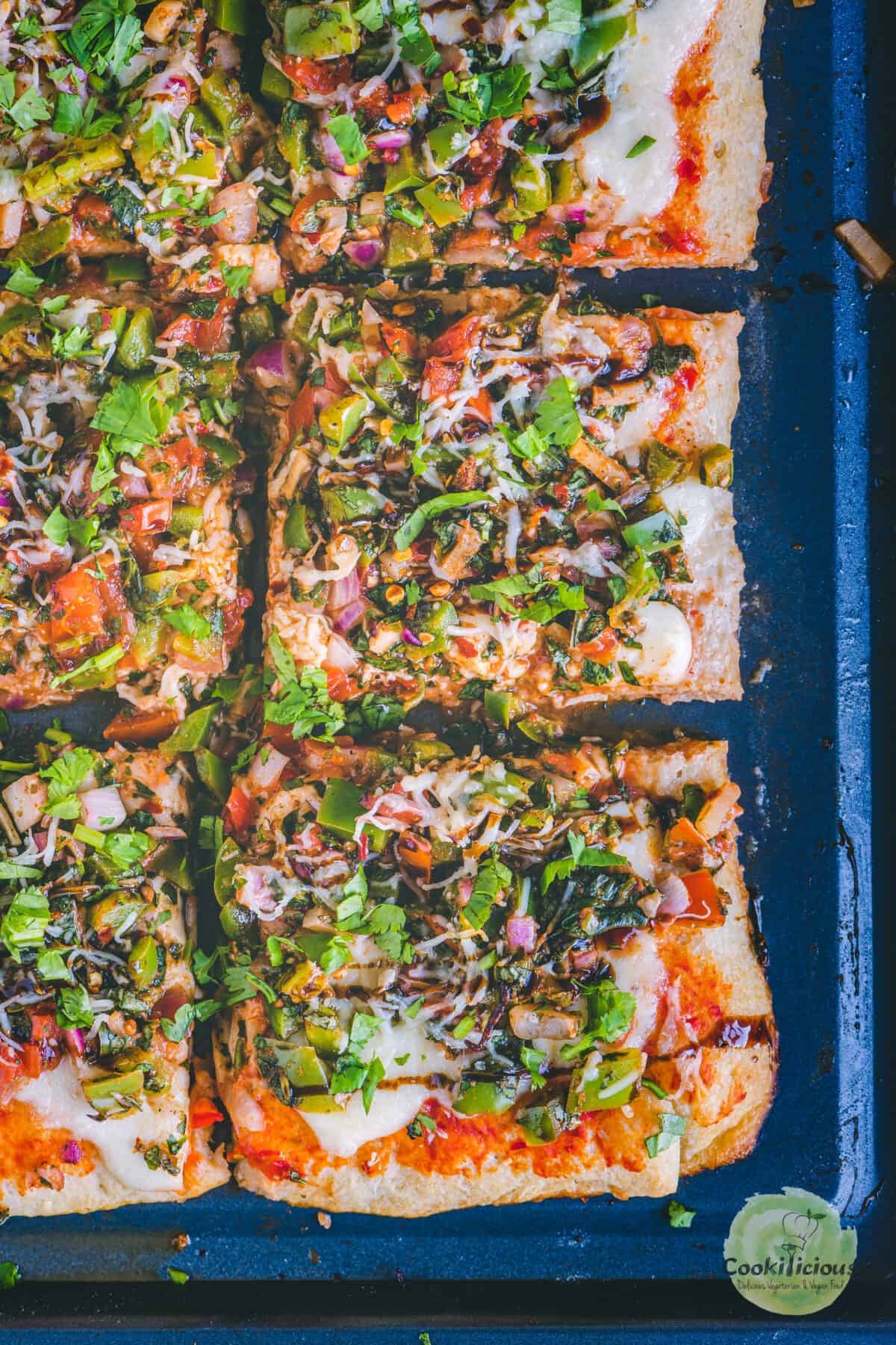 Easy Tomato Bruschetta Pizza with Balsamic glaze on top.