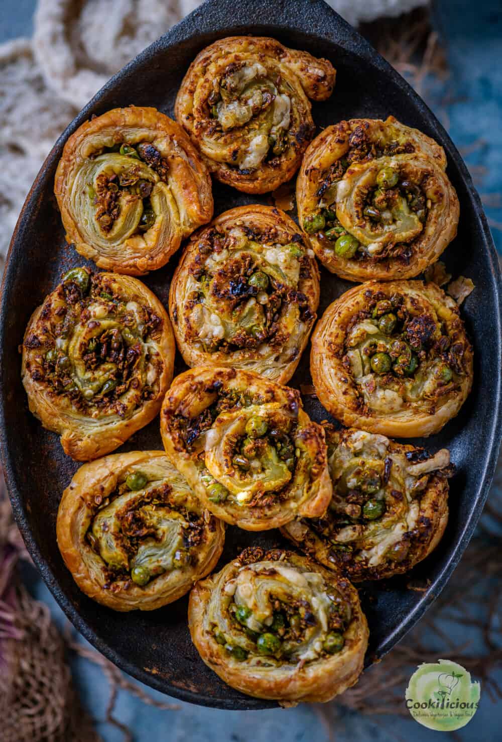 Puff Pastry Pinwheels With Matar Kachori Filling served in a platter.