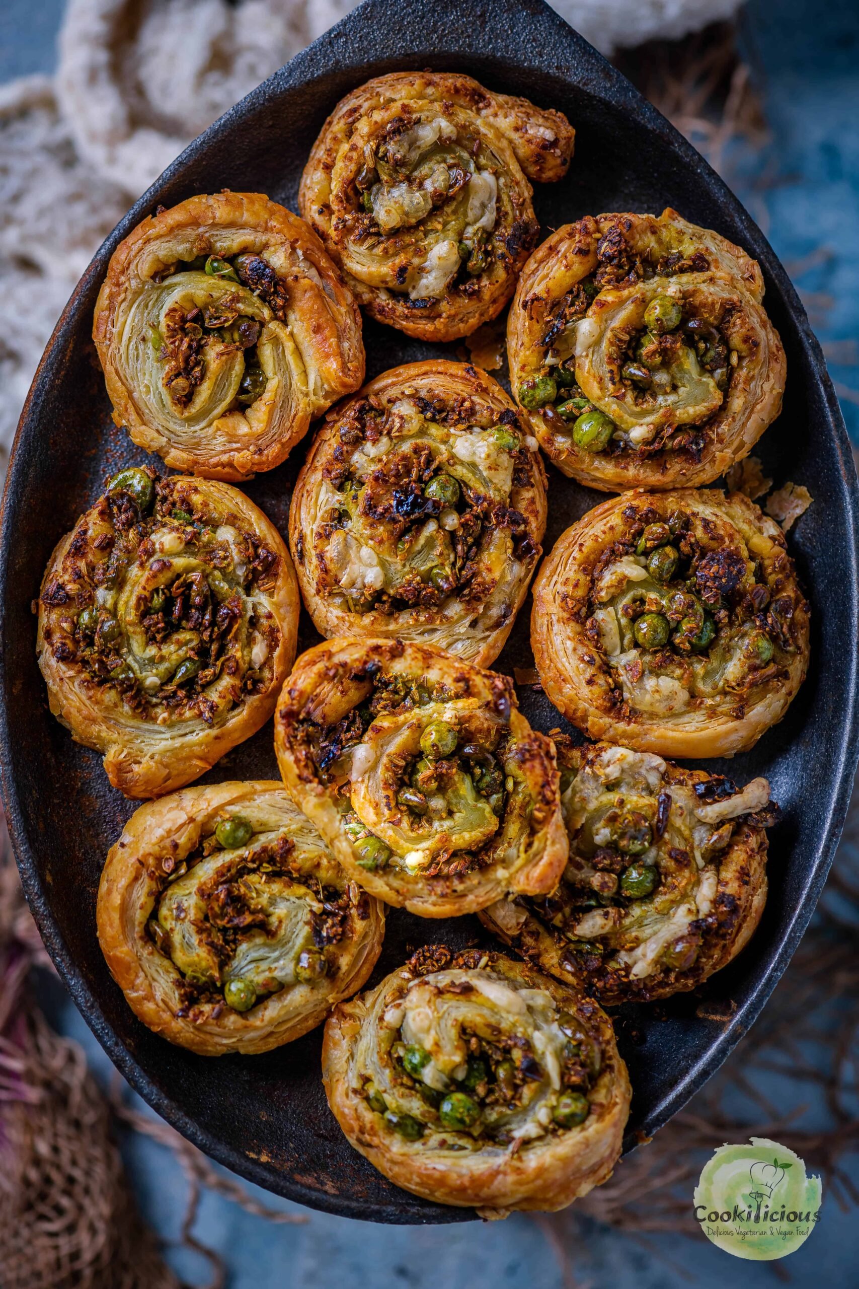 Puff Pastry Pinwheels With Matar Kachori Filling served in a platter.