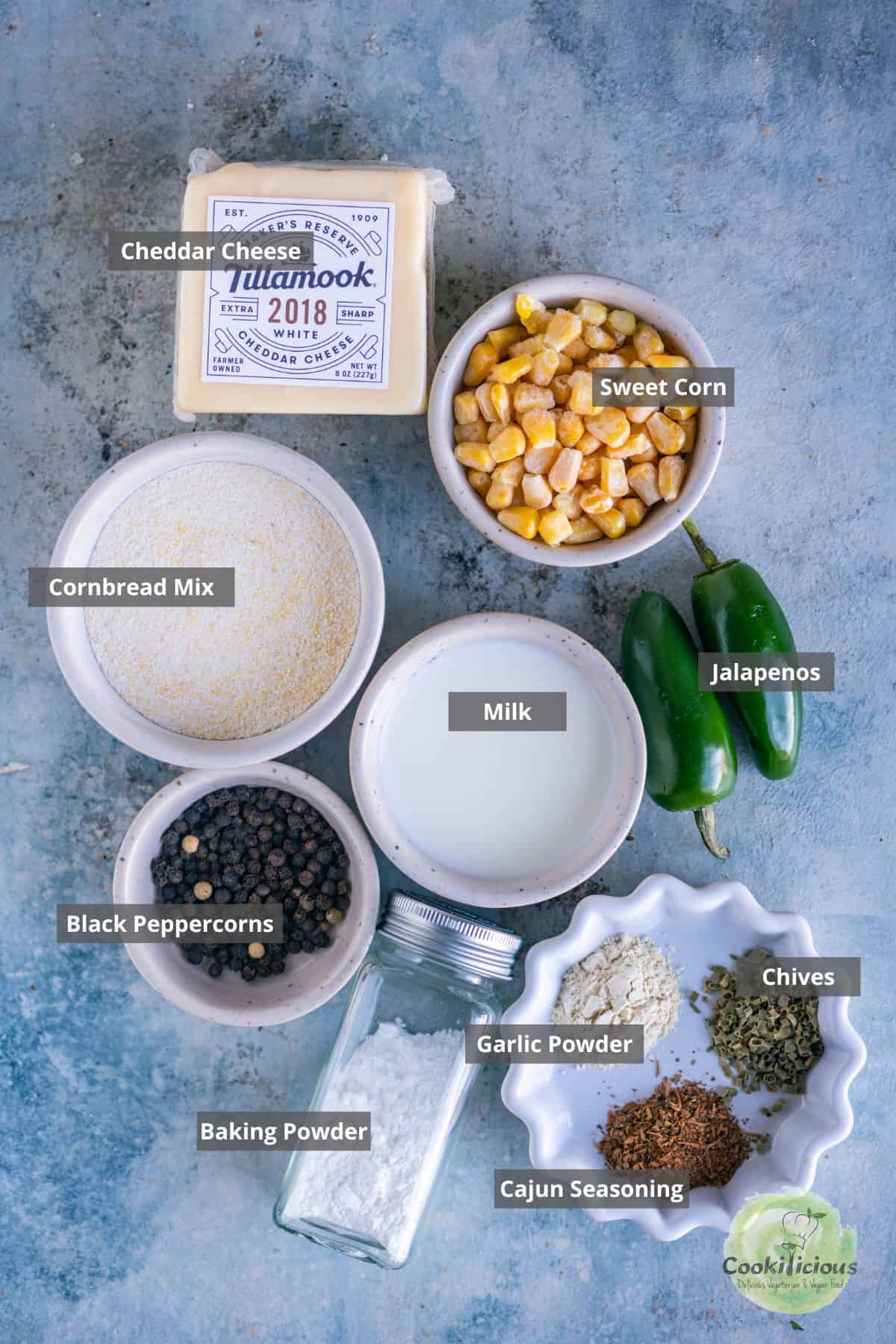 all the ingredients needed to make savory Eggless Jalapeno Cheddar Cornbread Biscotti placed on a table with labels on them.