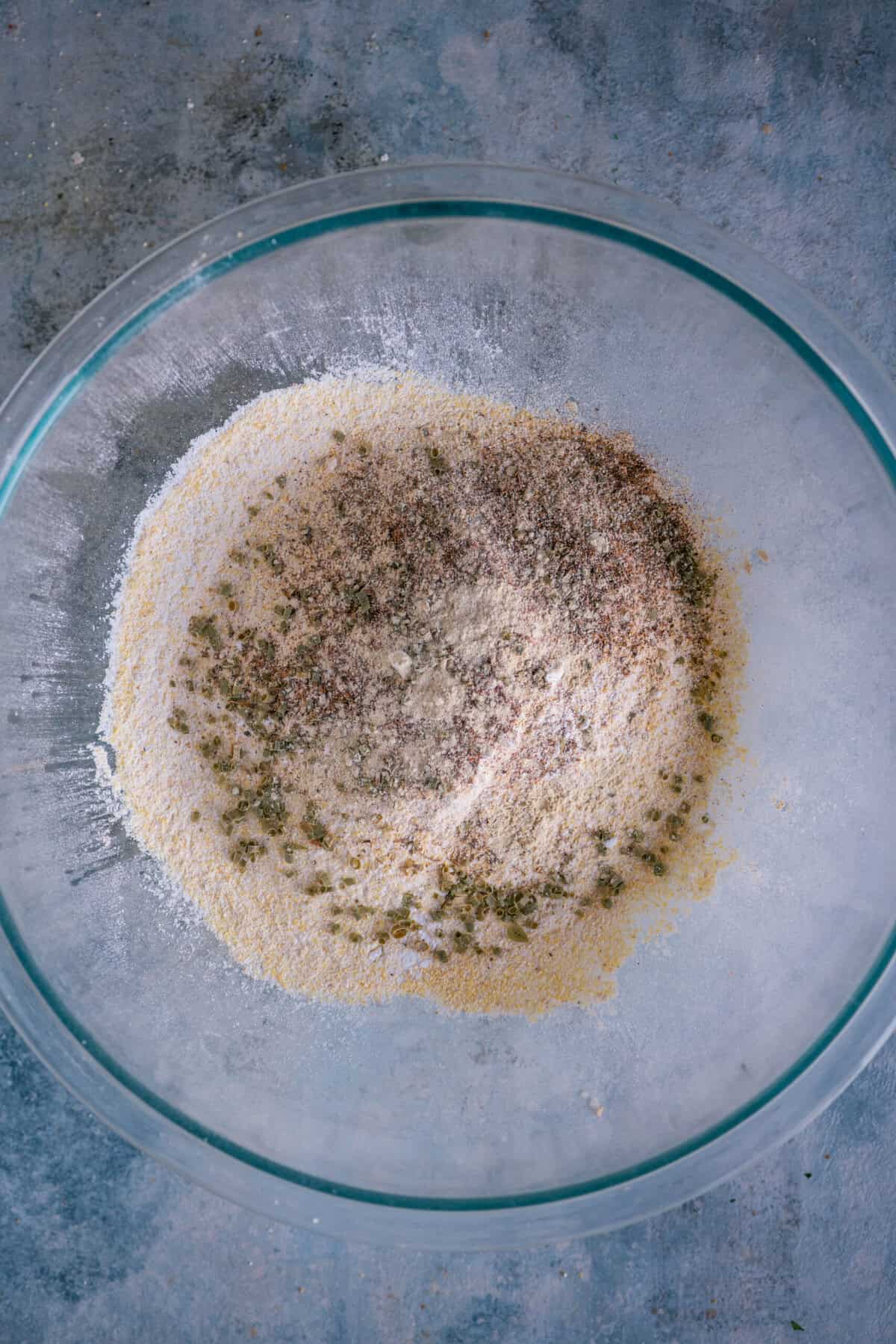 Garlic powder, Cajun seasoning and dried chives added to cornbread mix.