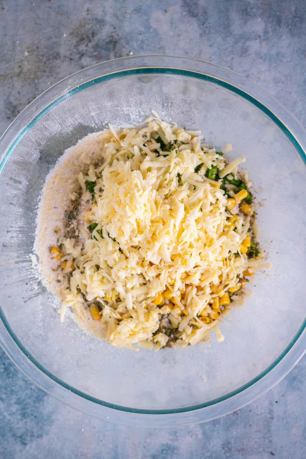 Grated sharp cheddar cheese added to the jalapeño cornbread mixture.
