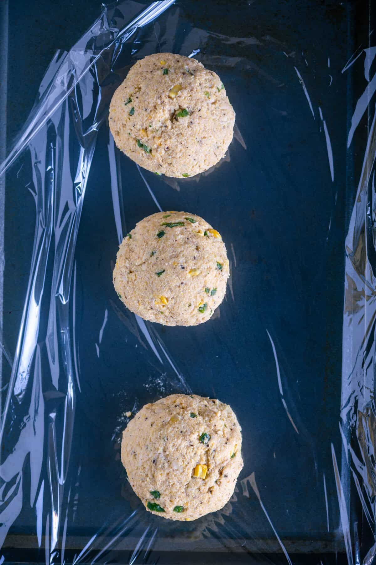 Biscotti dough divided into three equal portions.