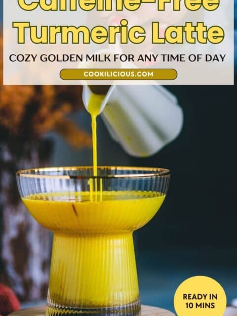 Pouring golden turmeric milk from a white jug into a ribbed gold-rimmed glass for a caffeine-free turmeric latte.
