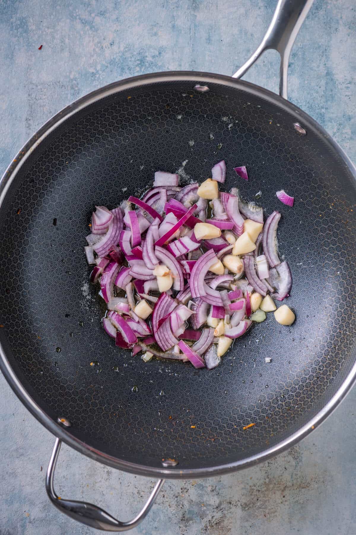 Sautéing garlic and onions in vegan butter for broccoli cheddar soup.